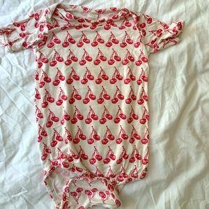 Bamboo onesie by Kate Quinn with red cherry pattern 6-12 months